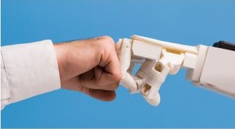 Fist and robotic hand do a fist bump representing AI and how it is changing content creation.